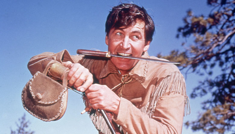 Fess Parker in Daniel Boone with Knife in Mouth