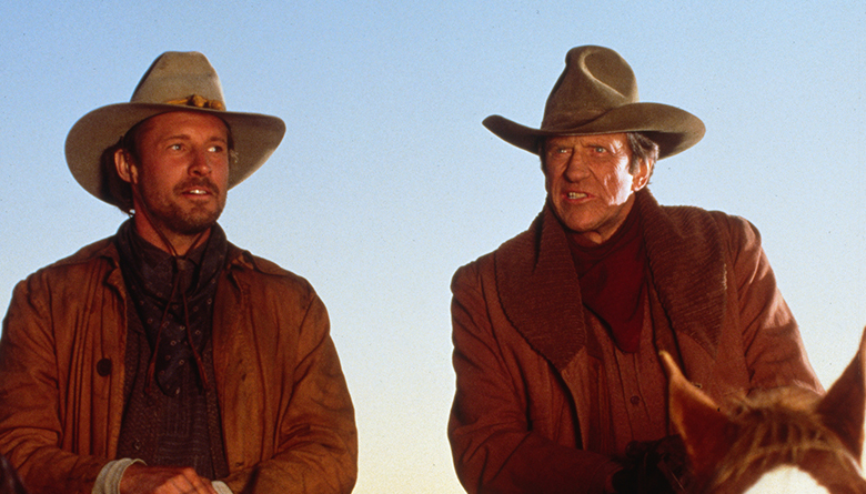 Bruce Boxleitner and James Arness in Red River